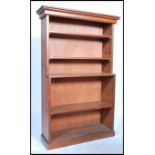 A good early 20th century Edwardian pitch pine country open bookcase having a series of adjustable