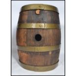 A vintage early 20th century point of sale / bar oak and four ring copper coopered drinks barrel.