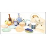 A collection of Royal Doulton to include Ashtrays , honey pot , cups, pear condiments , bowls , vase