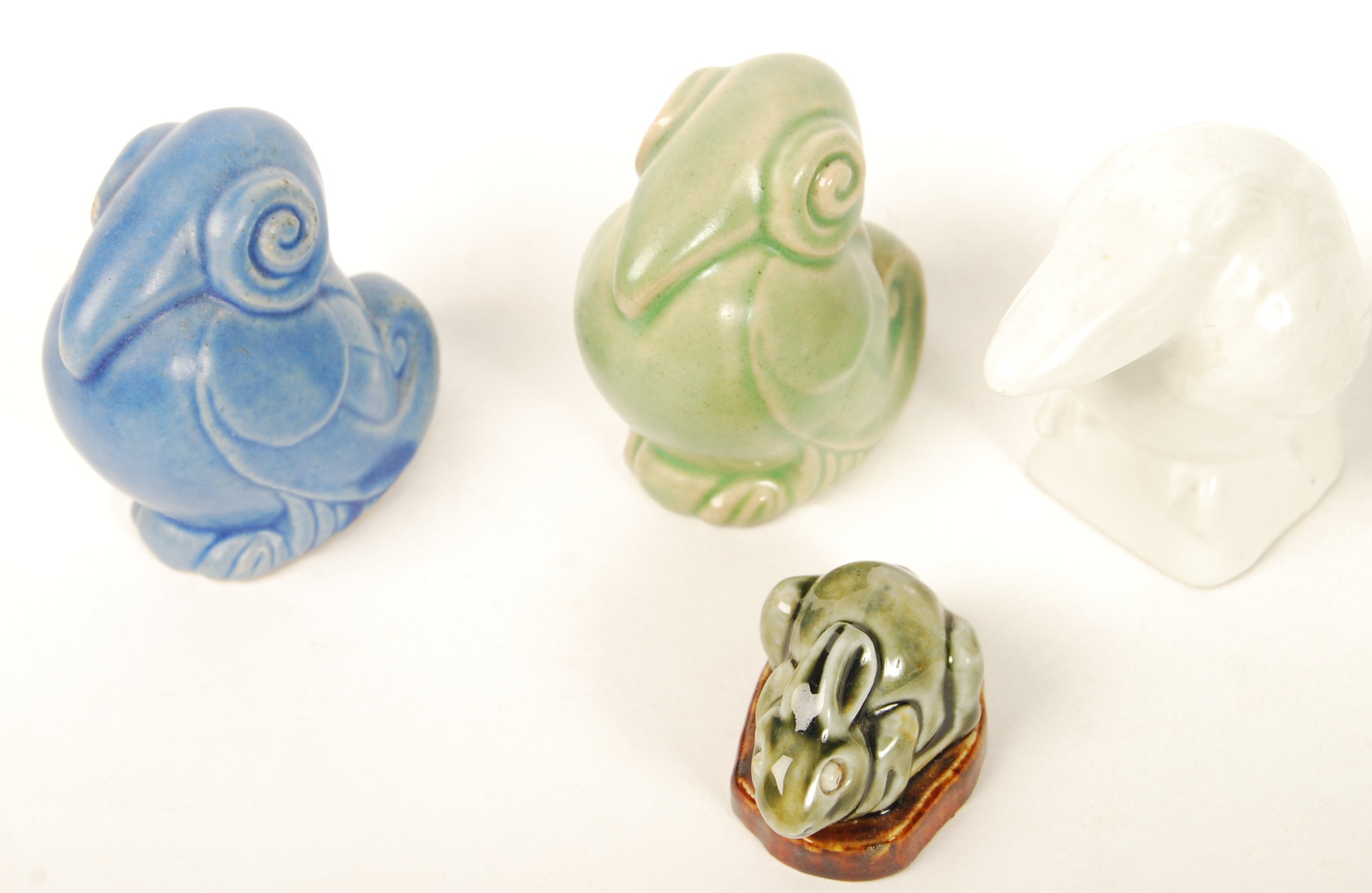 A group of Royal Doulton animals to include a pair of blue and green glazed scrolled birds , a plain - Image 2 of 4