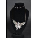 A sterling silver necklace chain having a plique a jour fairy pendant. Weighs 11 grams.