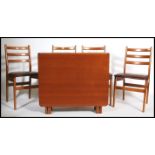 A 1970's retro teak wood drop leaf dining table together with a set of 4 matching teak dining chairs