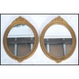 A pair of 19th century Victorian ornate wall mirrors having carved gilt frames. The central mirror