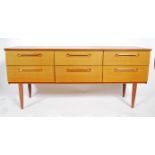 A retro 20th century teak wood sideboard, six drawers raised on shaped supports united bt
