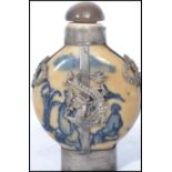 A 19th century Chinese perfume scent bottle having blue painted decoration with silver plated dragon