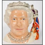 A Royal Doulton character jug depicting Her Majesty Queen Elizabeth II D7256 , handle modelled as