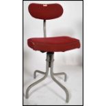 A retro mid century Tansad Industrial office - clerks swivel chair. Raised on a tubular metal base