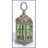 A continental silver hallmarked lantern of hexagonal form having six green glass panels. Raised on