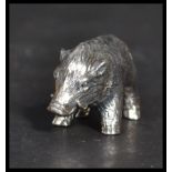 A sterling silver miniature figurine of a wild boar. Weighs 13 grams.