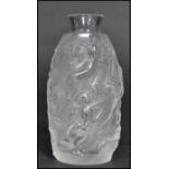 A Lalique pressed glass miniature vase depicting nude maiden and flowers. Etched signed to base