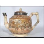 A 19th century Oriental Japanese teapot decorated with traditional scenes having a Victorian