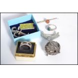 A group of vintage costume jewellery to include a Cleopatra style brooch, silver earrings with