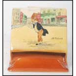 A 20th century Royal Doulton Pickwick match box holder match strike depicting Mr Pickwick and Mr