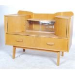 A vintage retro teak wood sideboard / dressing table series of drawers raised on shaped tapering