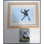 A framed and glazed Banksy Bristol street artist print Flower Bomber 6/50 along with Banksy postcard