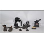 A collection of items to include a vintage coffee grinder, shoe last, axe head, clogs etc please