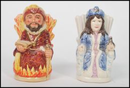 A pair of Royal Doulton toby jugs entitled ' The Ice Queen ' D7071 and ' The Fire King ' D7070 ,