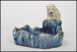 A Royal Doulton Lambeth bibelot / trinket dish depicting a polar bear on a glacier overlooking a