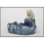 A Royal Doulton Lambeth bibelot / trinket dish depicting a polar bear on a glacier overlooking a