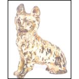 An early 20th century cold painted bronze figurine of a dog modelled in a seated position.