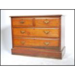 A 19th century Victorian chest of drawers having two short drawers over two long drawers raised on a