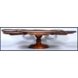 A 19th century Victorian mahogany and oak lazy Susan sectional serving plate having a revolving