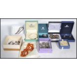 A group of vintage sterling silver jewellery to include necklaces , bracelets , pendants , charms