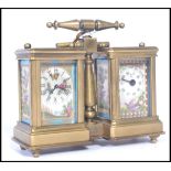 A vintage early 20th century brass carriage style clock and barometer compendium with porcelain