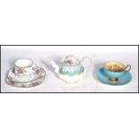 A group of ceramics to include a Royal Albert Enchantment tea pot a Petit Point tea cup saucer and