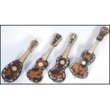 A group of four 19th century Victorian miniature mandolins and guitars. Of tortoiseshell
