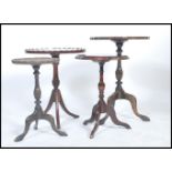 A collection of 20th century mahogany tripod wine tables each raised on splayed tripod leg bases