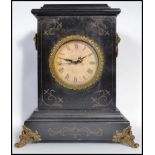 A vintage 20th century ebonised mantle clock having ormolu mounts with inset clock face. 39cm tall.