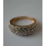 A hallmarked 9ct gold ring having pave set CZ dome. Hallmarked Sheffield. Size L.  Weight 2.6g.