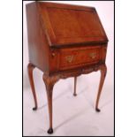 A mid century Queen Anne revival burr walnut ladies writing bureau. Raised on cabriole legs with