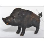 A 19th century Victorian black-forest carved novelty inkwell in the form of a boar with painted eyes