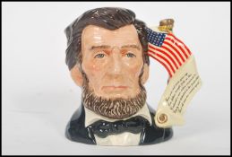 A Royal Doulton character jug depicting President Abraham Lincoln D6936 , handle modelled after