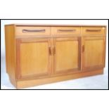 A retro 20th century G - Plan Fresco teak wood low sideboard having an arrangement of drawers and