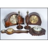 Two vintage early 20th century wooden cased mantel clock along with two vintage barometers and a