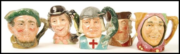 A group of five Royal Doulton Character jugs to include Auld Mac Bang Went Saxpence , The Walrus and