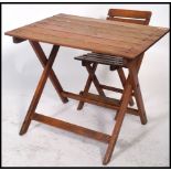 A retro 1970's child's camping teak slatted folding table / desk with matching chair. Measures