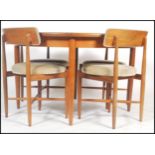 G plan - Fresco range - A 1960's teak extending round table together with a set of four chairs