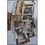 Postcards; a collection of assorted early 20th century postcards to include real photo, artist