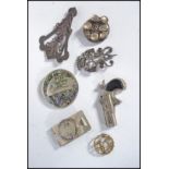 A group of vintage jewellery to include to include a silver white metal double dragon crown brooch a