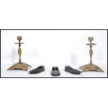 A pair of 19th century brass ecclesiastical candlesticks, each with single sconces together with a
