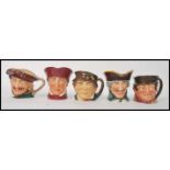A group of five Royal Doulton character jugs to include Paddy , Sam Weller , Dick Turpin , Drake ,