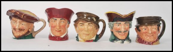 A group of five Royal Doulton character jugs to include Paddy , Sam Weller , Dick Turpin , Drake ,