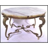 An ornate 20th century shaped onyx topped coffee / centre table supported by a gilt brass stand