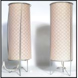 A pair of matching retro 20th century table / bedside lamps, each lamp constructed from a simple