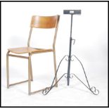 A single vintage mid 20th century tubular framed panel seat stacking chair together with a wrought