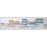 A TG Green vintage blue and white stripe part service comprising bowls, jugs of varying sizes, sugar